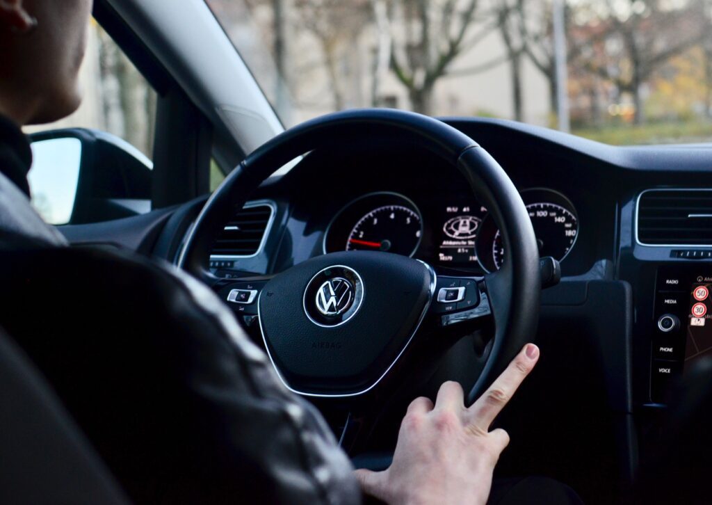 BMW automatic gear selector and center console controls showing drive modes and parking brake 