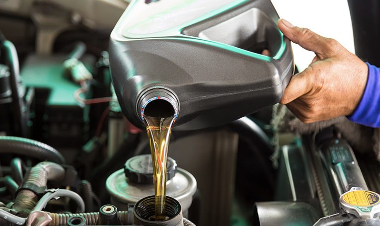 Mechanic changing oil